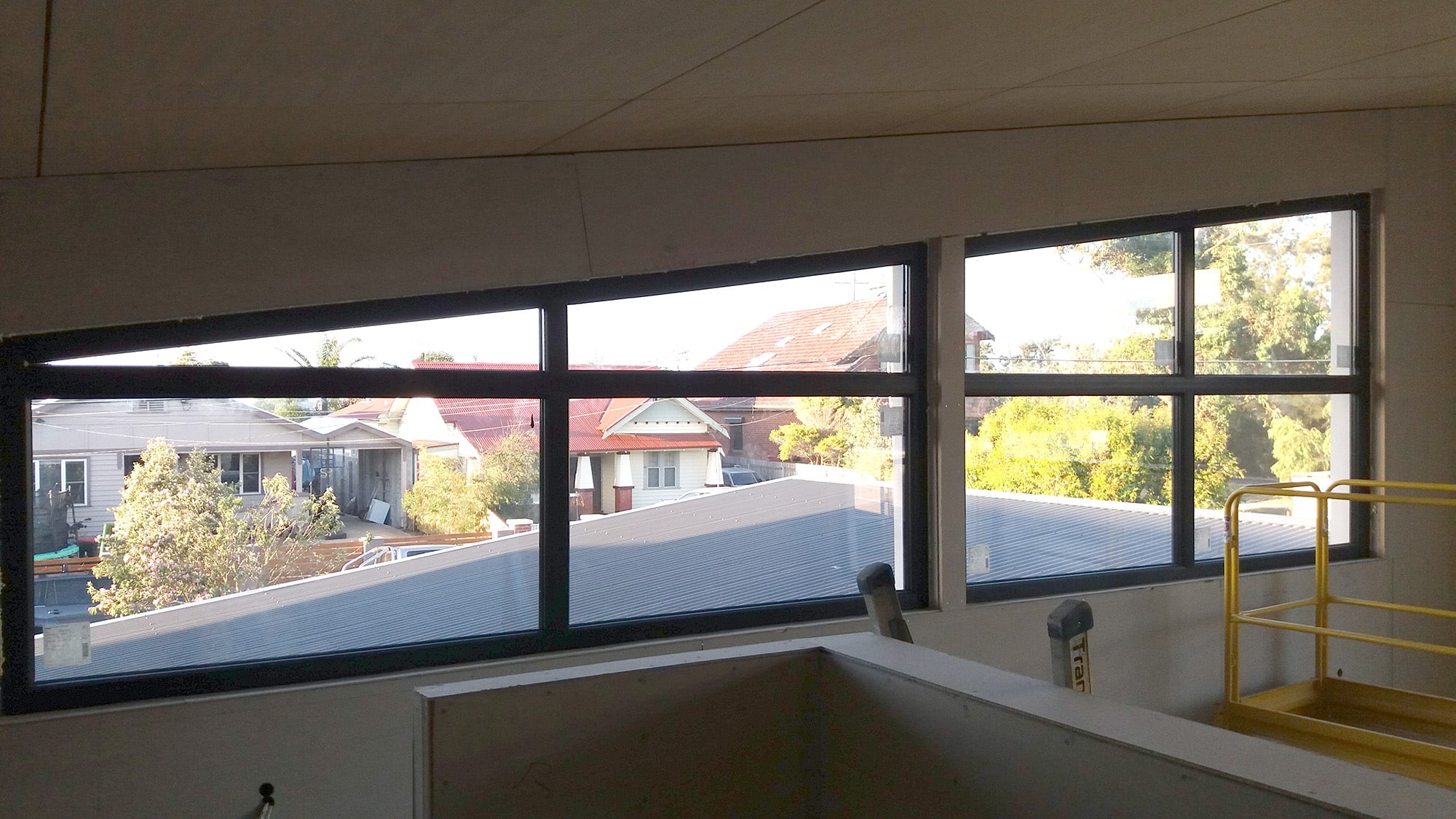 Black brown coloured shaped and butt joint fixed windows