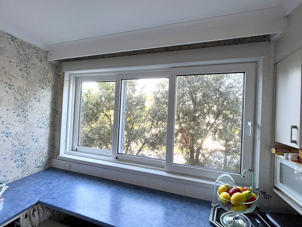 White sliding stacker window in the kitchen