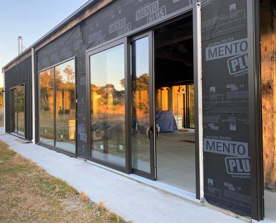 Ceylon black sliding doors in new building construction