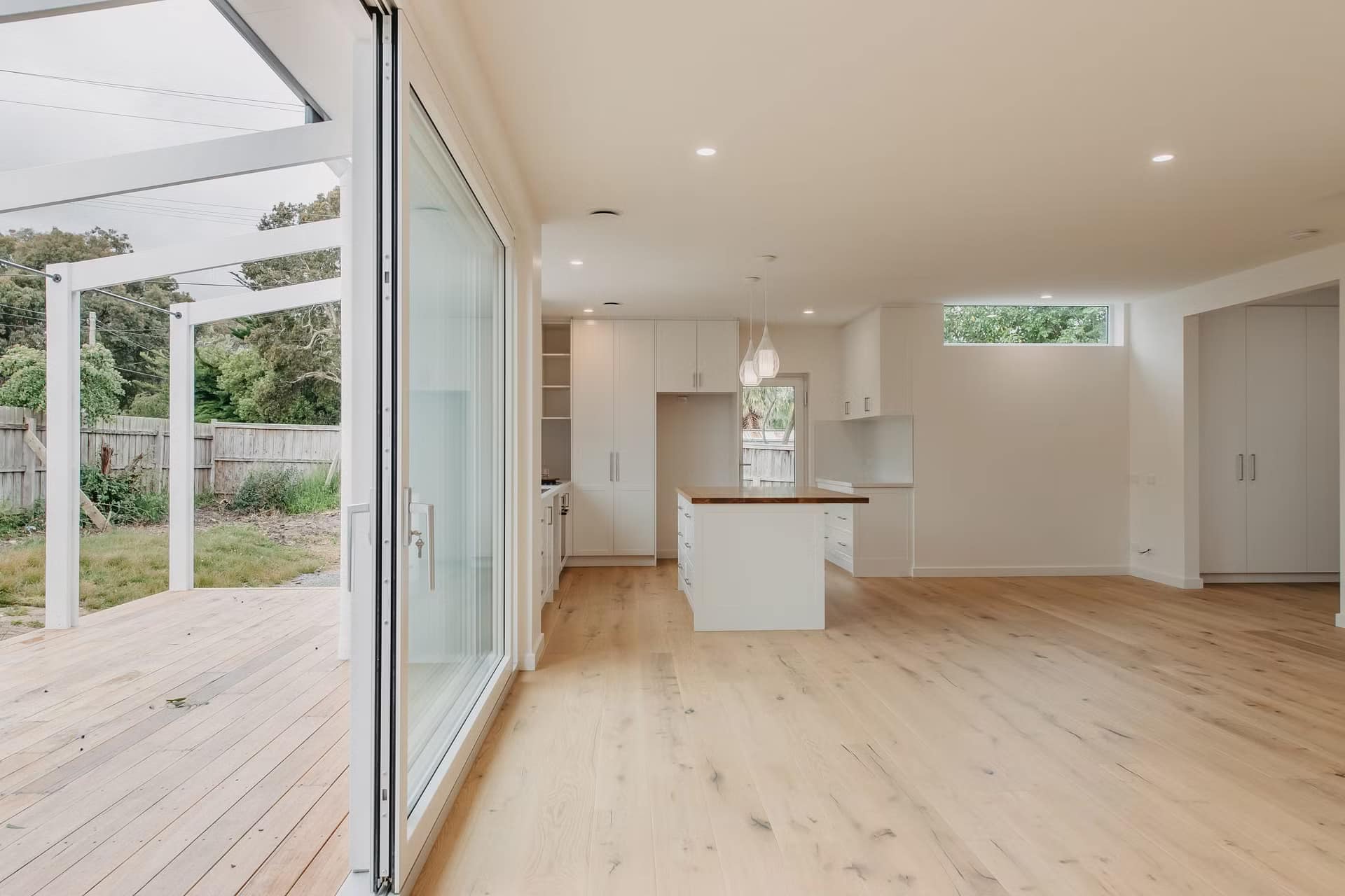 white lift and slide door opens to the garden