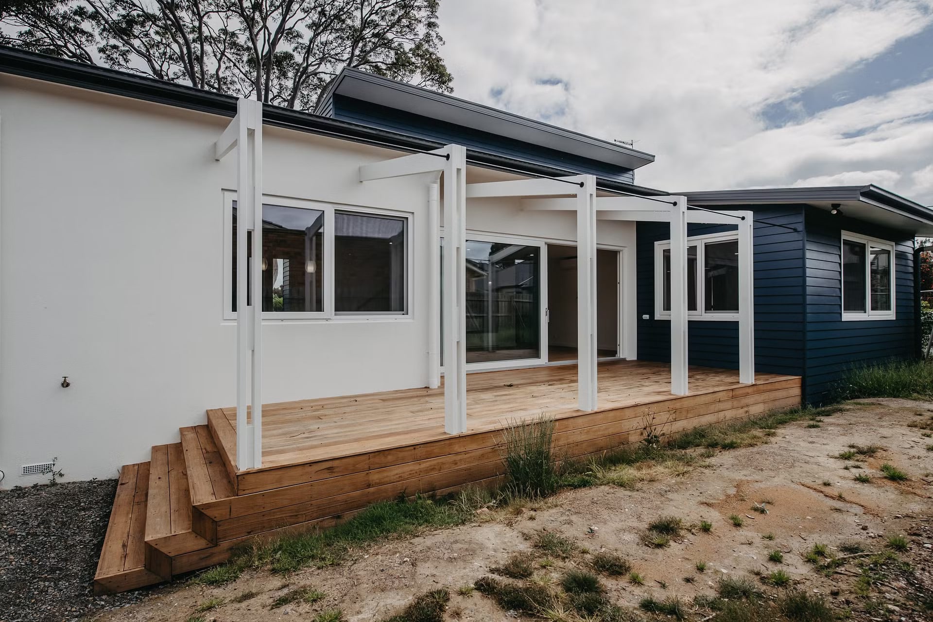 White color lift and slide window and door at the entrance of the house