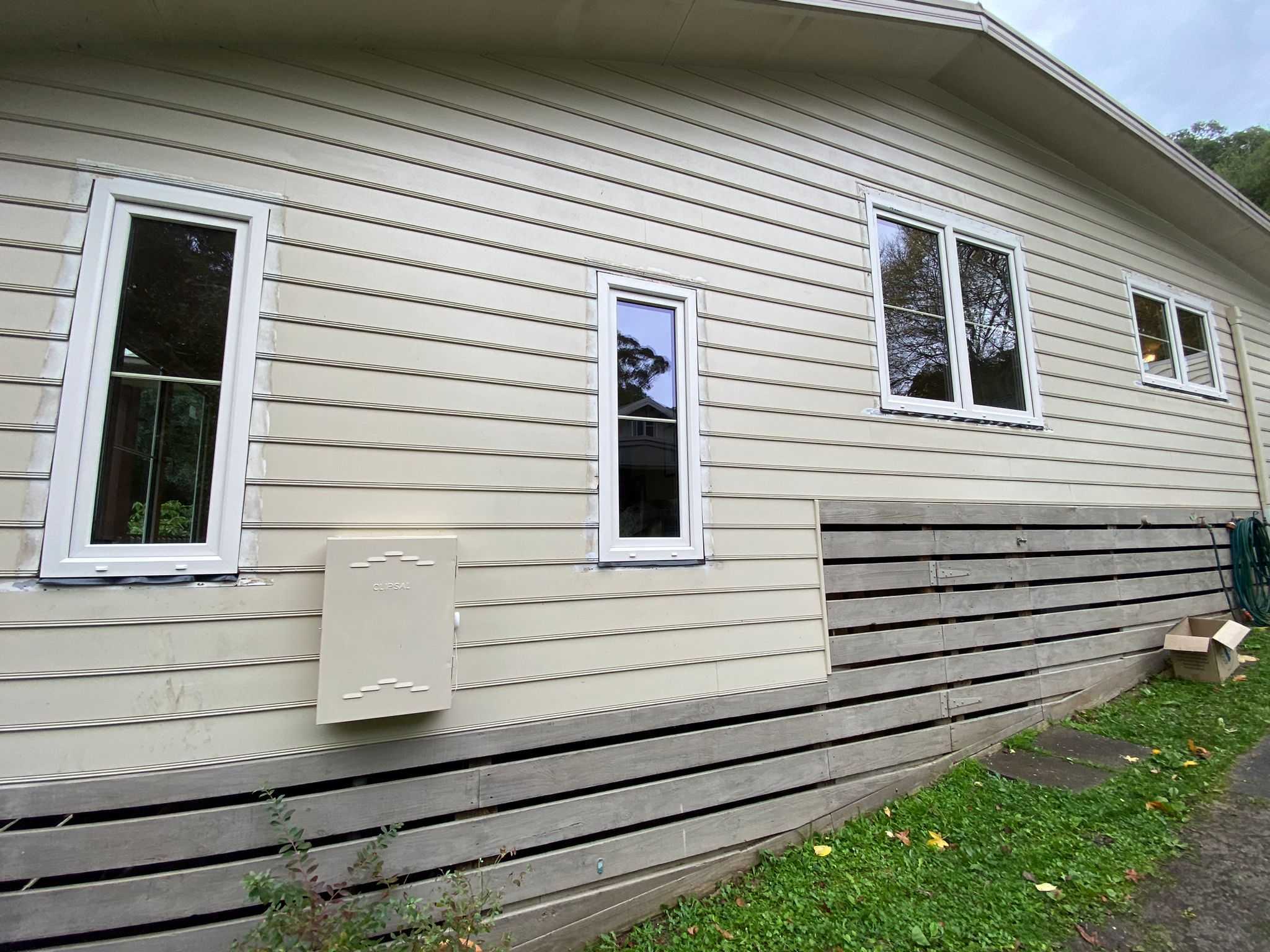 cream coloured tilt and turn windows and fixed windows facing the garden